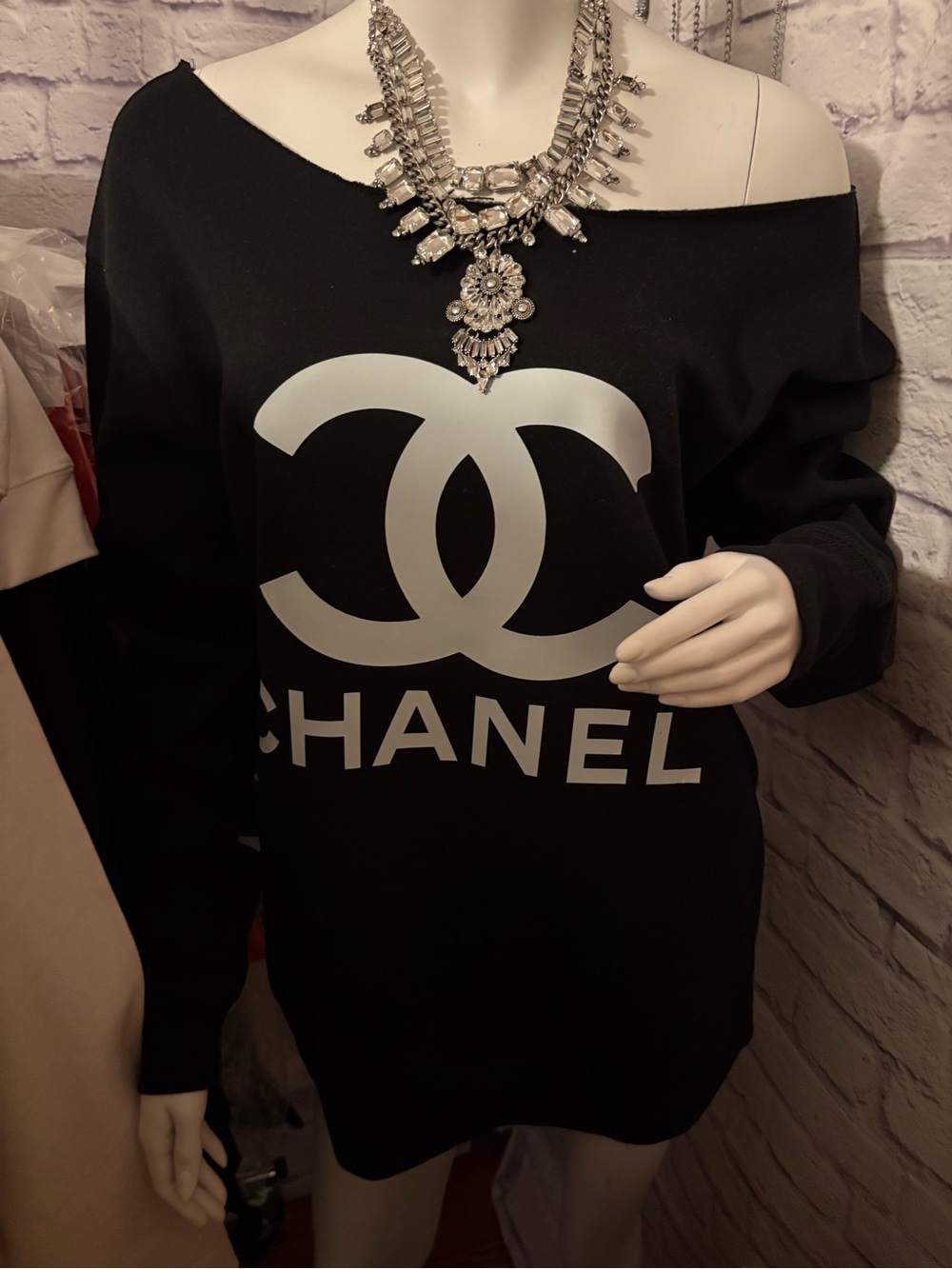 Source unknown  Black Sweatshirt with White Logo